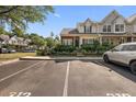 Beautiful townhome with landscaped yard, showcasing curb appeal at 312 Kelsey Blvd, Wando, SC 29492