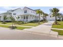 Picturesque curb appeal of a two-story home with a charming porch and beautiful landscaping at 3769 Summerton St, Mount Pleasant, SC 29466