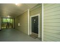 Hallway with a doormat, unit number, and access to stairs at 45 Scyamore Ave # 623, Charleston, SC 29407