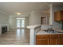Open-concept living area with a fireplace and access to the patio, seamlessly connecting indoor and outdoor spaces at 45 Scyamore Ave # 623, Charleston, SC 29407
