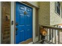 Welcoming front door with a charming birdhouse, a video doorbell, and sidelight with brick exterior at 518 Woodward Blvd, Summerville, SC 29483