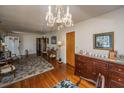 Formal living room featuring hardwood floors, decorative chandelier, and traditional furnishings at 5302 Helene Dr, North Charleston, SC 29418