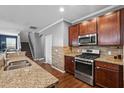 Granite countertops complement the stainless steel appliances in the spacious kitchen; convenient and stylish at 536 Man O War Ln, Moncks Corner, SC 29461