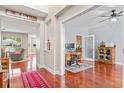 Spacious home office with hardwood floors, complemented by a nearby living area for flexible living at 644 Grassy Hill Rd, Summerville, SC 29483
