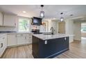 Bright, modern kitchen boasts a large island and stainless steel appliances at 670 Dupre Rd, McClellanville, SC 29458