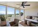 Cozy screened porch featuring comfortable seating and ocean views at 7 Beach Club Villas, Isle of Palms, SC 29451
