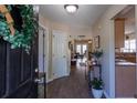 Welcoming entryway with hardwood floors, leading into an open-concept living space at 7322 Stoney Moss Way, Hanahan, SC 29410