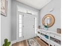 Inviting entryway with white trim, and a decorative mirror, creating a warm and welcoming atmosphere at 9616 Pebble Creek Blvd, Summerville, SC 29485