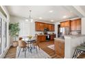 Bright kitchen with stainless steel appliances, wood cabinets and floors, and a breakfast nook area at 123 Gaslight Blvd, Summerville, SC 29483