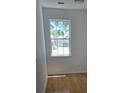 Bright bedroom with a large window, hardwood floors, and neutral walls at 1346 Ellison Run, Charleston, SC 29412