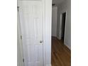 Hallway with a closet, hardwood floors, and white painted walls at 1346 Ellison Run, Charleston, SC 29412