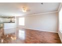 Spacious living room featuring gleaming hardwood floors, neutral walls, and abundant natural light at 167 Meadow Wood Rd, Summerville, SC 29486
