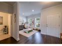 Spacious living area with a playroom, dark floors and natural light at 2024 Lanneau Ln, Johns Island, SC 29455