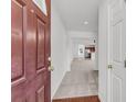 Bright entryway showcasing neutral carpeting and a view into the living spaces at 210 Wildberry Ln, Goose Creek, SC 29445