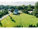 Aerial view highlighting the expansive lawn and charming neighborhood setting at 21877 Lowcountry Hwy, Ruffin, SC 29475