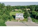 Aerial view of beautiful home with a metal roof, large yard, and surrounding greenery at 21877 Lowcountry Hwy, Ruffin, SC 29475