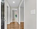 Bright hallway featuring fresh paint, modern lighting, and hardwood floors throughout at 245 Clarine Dr, Goose Creek, SC 29445