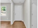 Hallway showing hardwood floors, fresh paint, and an exterior view through a window at 245 Clarine Dr, Goose Creek, SC 29445