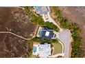 Aerial view of the property with a pool, waterfront access, and lush greenery at 2705 Parkers Landing Rd, Mount Pleasant, SC 29466