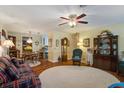 Cozy living room featuring hardwood floors, a ceiling fan and unique furnishings at 344 Lantana Dr, Charleston, SC 29407