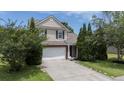Charming two-story home featuring a driveway and a well-manicured front yard with lush greenery at 406 Brookfield Ln, Goose Creek, SC 29445