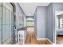 Inviting foyer with hardwood floors, neutral wall colors, console table, and bright natural light at 519 Tarleton Dr, Summerville, SC 29483