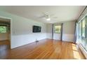 Bright living room featuring hardwood floors, large windows, and a ceiling fan providing comfort at 7 Plainfield Dr, Charleston, SC 29407