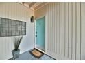 Charming entryway with a blue door, welcome mat, and decorative potted plant at 93 Ashley Hall Plantation Rd # 6, Charleston, SC 29407