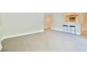Open living room area with breakfast bar and modern stool seating at 93 Ashley Hall Plantation Rd # 6, Charleston, SC 29407