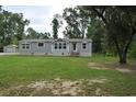 Well-maintained home with green lawn, showcasing its curb appeal with lots of space at 123 Christina Ln, Summerville, SC 29483