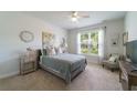 Bright bedroom with neutral tones, cozy carpet, and a large window offering natural light at 1250 Hammrick Ln, Johns Island, SC 29455