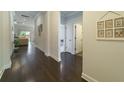 Inviting hallway with hardwood floors and elegant decor leading to living spaces at 1250 Hammrick Ln, Johns Island, SC 29455