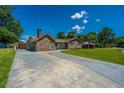 Beautifully landscaped home with a wide driveway, offering ample parking space and curb appeal at 127 Rahway Rd, Goose Creek, SC 29445