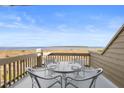 Relax and enjoy panoramic ocean views from the charming balcony dining set in this coastal retreat at 1334 Pelican Watch Villas, Seabrook Island, SC 29455