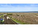 Enjoy expansive ocean views from this inviting balcony, perfect for relaxation and outdoor dining at 1334 Pelican Watch Villas, Seabrook Island, SC 29455