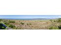 Panoramic beach view showcases scenic trails and stunning coastal scenery on a sunny day at 1334 Pelican Watch Villas, Seabrook Island, SC 29455