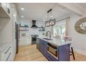 Bright kitchen with a center island, modern appliances, and sleek countertops at 15 Dewey St, Charleston, SC 29403