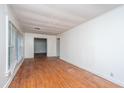 Bright living room features hardwood floors and large windows at 1612 Evergreen St, Charleston, SC 29407