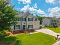 Charming two-story home features a well-kept lawn, boat parking, and attached two car garage at 2005 Thornhill Dr, Summerville, SC 29485