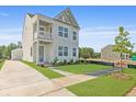 Beautiful two-story home showcasing a well-manicured lawn and inviting facade at 212 Terrace View Dr, Summerville, SC 29486