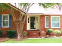 Inviting front entrance featuring a brick facade, well-maintained landscaping, and a cozy entryway at 2206 Hunter Creek Dr, Charleston, SC 29414