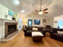 Spacious living room featuring hardwood floors, a fireplace, and comfortable furnishings at 2206 Hunter Creek Dr, Charleston, SC 29414
