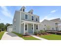 Beautiful two-story home with a covered porch and a well-maintained yard at 222 Terrace View Dr, Summerville, SC 29486