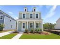 Charming two-story home with a covered front porch and a manicured lawn at 222 Terrace View Dr, Summerville, SC 29486