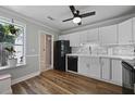Bright kitchen showcasing stainless steel appliances and a view to a clean bathroom at 252 Howle Ave # C3, Charleston, SC 29412