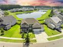 Beautiful aerial view of a suburban home near a serene lake at 438 Flat Rock Ln, Summerville, SC 29486