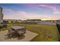 Enjoy backyard views of the water from the patio, perfect for entertaining at 515 Purple Finch Rd, Summerville, SC 29486