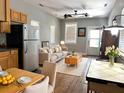 Bright living room with hardwood floors, neutral walls, ceiling fan, and comfortable seating area at 7 Dingle St, Charleston, SC 29403