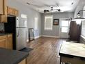 Bright, open living room with hardwood floors, neutral walls, and a view to the front door at 7 Dingle St, Charleston, SC 29403
