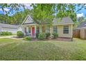 A cozy single-story home with a well-kept lawn and landscaping, complemented by a quaint front porch at 1004 Providence Way, Summerville, SC 29483
